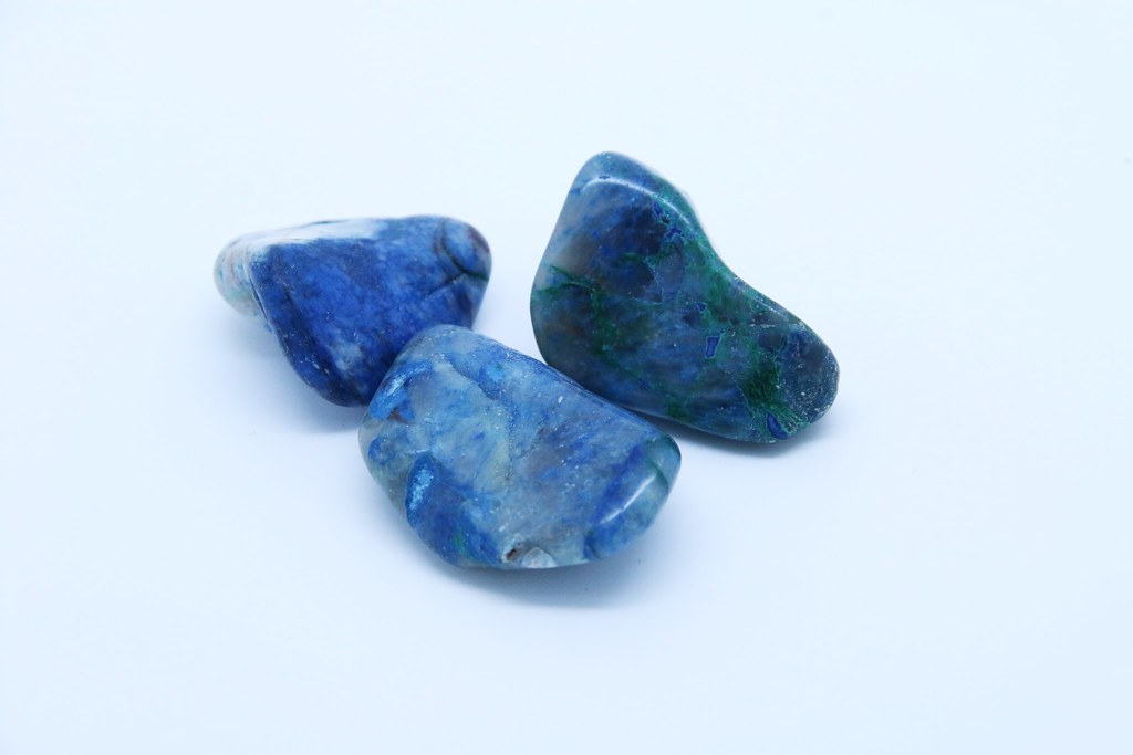 A hydratedcopperphyllosilicatemineral - includes Malachite Azurite and Cuprite - Higher grade is opaque bright blue/green. Lower grade is quartz with blue/green inclusions