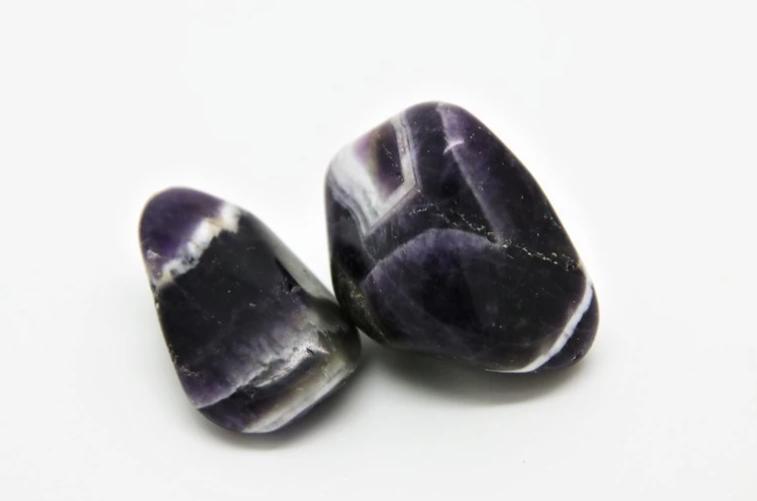 Purple/lilac colour with areas or bands of clear-white quartz