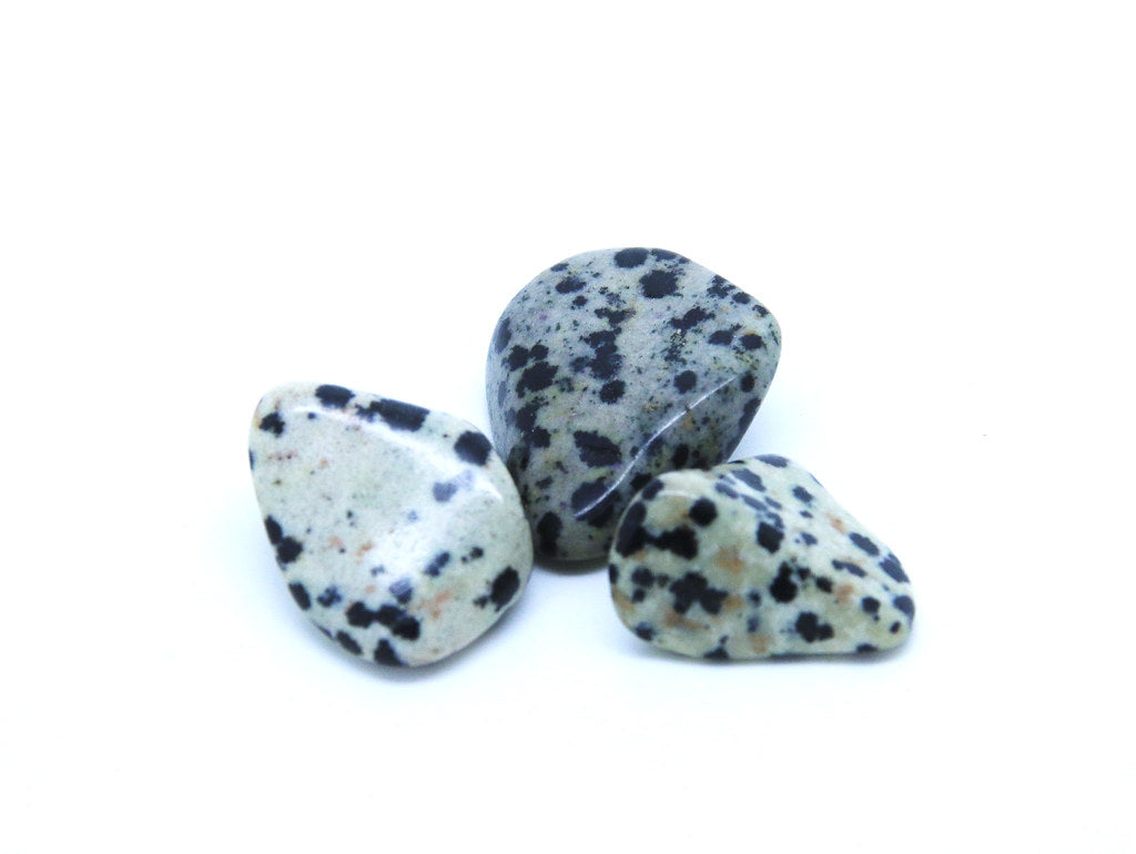 A beige/cream coloured mineral mix called albite with black spots of arfvedsonite - Any colour varieties are dyed.