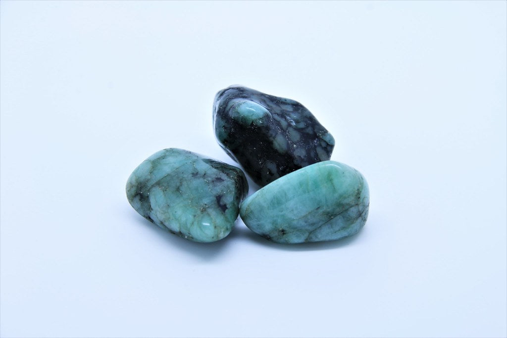 Dark/Kakhi Green translucent - opaque colour (beryl) mixed with a black mineral