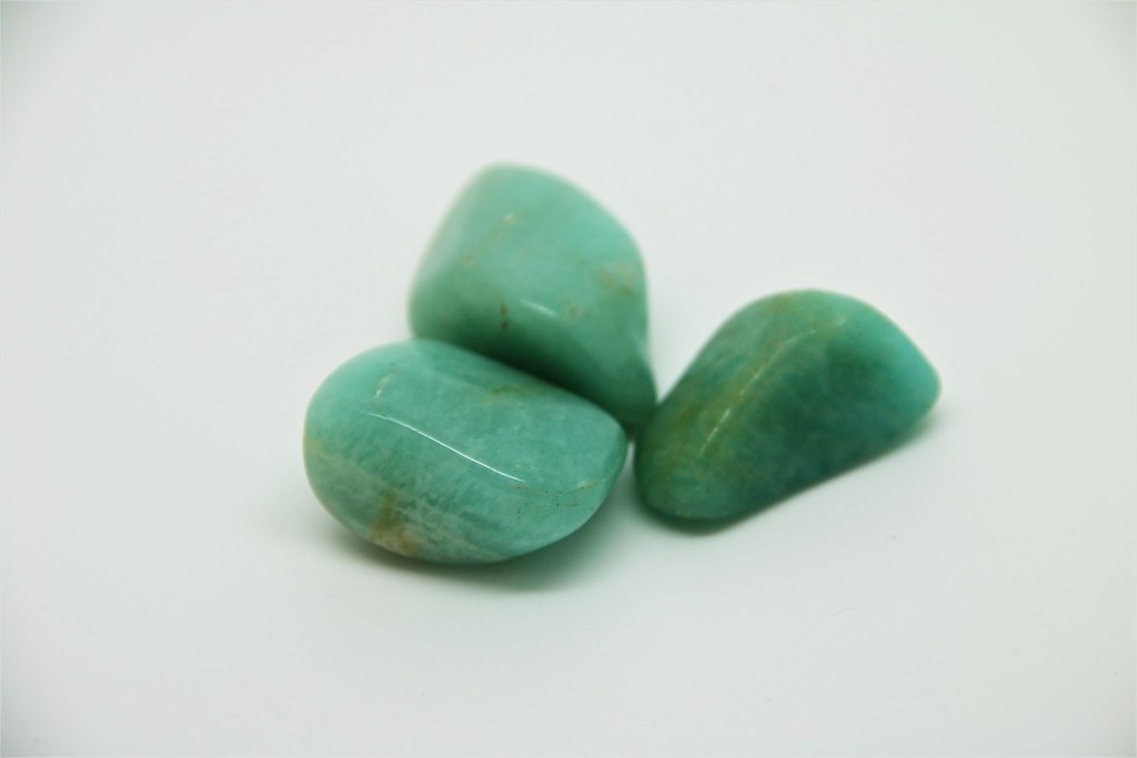 A green, turqouise or light blue colour depending in source - Named after the green coloured stones found at the Amazon river, though not sourced there.